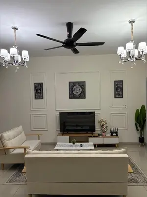 a living room with a ceiling fan and a couch at AFA Home KKB in Kuala Kubu Baharu