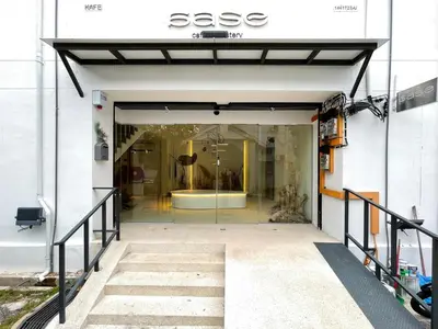 an entrance to a store with a glass door at Lili Stay by the beach in George Town