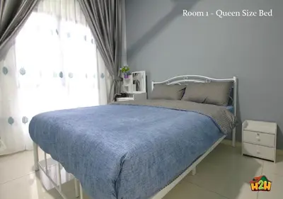 a bedroom with a bed with a blue blanket and a window at H2H - Horizon18 @ Ipoh Town Center in Ipoh