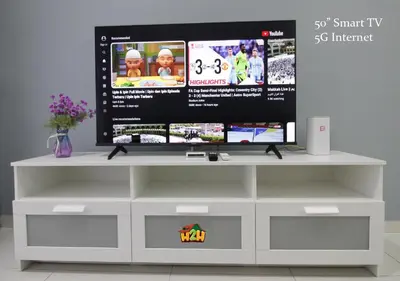 a tv sitting on top of a white entertainment center at H2H - Horizon18 @ Ipoh Town Center in Ipoh