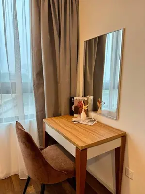 a table with a mirror and a chair next to a window at Lost World Tambun 1BR 3/4Pax @Sunway Onsen Suite in Kampong Batu Lapan