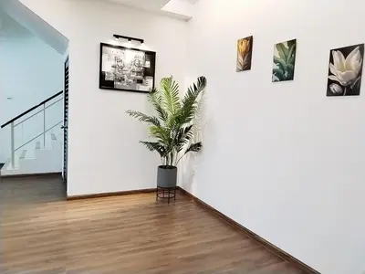 a potted plant in a room with white walls at 13Pax -2 Storey Bayu Mutiara Bukit Mertajam Penang in Bukit Mertajam