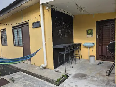 a building with a bar on the side of it at CASA AINA at Gopeng Cozy & Comfy Home in Kampong Kepayang