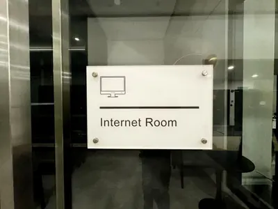a sign for an internet room on a glass door at Georgetown Classic Collection 3BR-10PAX in George Town