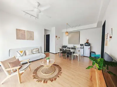 a living room with a couch and a table at 3410 Home4Stay TownArea NewCozyHome InfinityPool in Jelutong