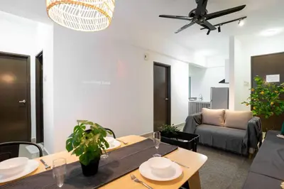 a living room with a table and a couch at Chic - 4 bedroom - Projector - Ipoh Town - Sleep8 in Ipoh