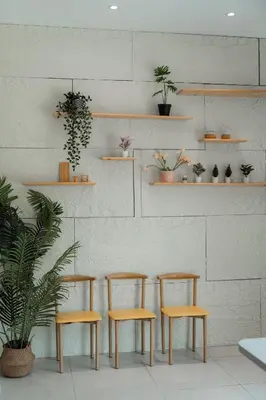 a room with four chairs and shelves with plants at BrandNew Premium House 4Room12Pax@ALMA NEAR JUSCO in Bukit Mertajam