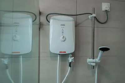 a room with two medical devices on a wall at BrandNew Premium House 4Room12Pax@ALMA NEAR JUSCO in Bukit Mertajam
