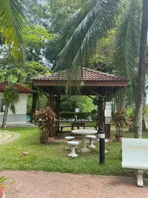 a gazebo with a table and a picnic table at Sea View Penthouse Comfy Home at Batu Ferringhi in Batu Ferringhi