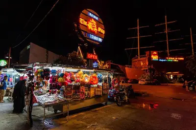 a market with a stand filled with lots of toys at Sea View Penthouse Comfy Home at Batu Ferringhi in Batu Ferringhi