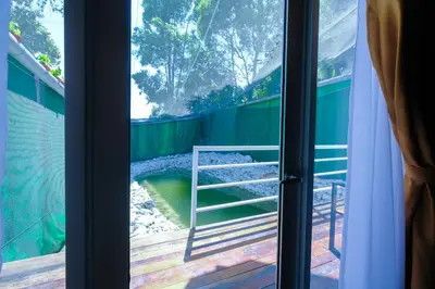 a view from the window of a balcony at Woodcookies Guesthouse in Pangkor