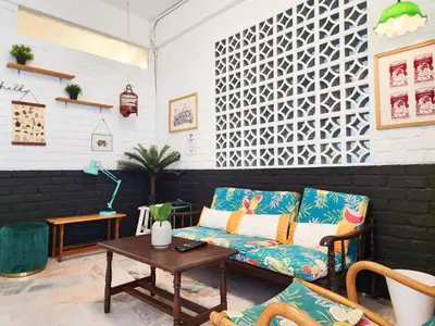 a living room with a couch and a table at Ipoh Station 18, Aeon Ipoh Rainforest 2 rooms LOFT 2 Homestay in Ipoh