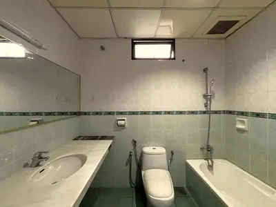 a bathroom with a sink and a tub and a toilet at Cool Point Hotel in Tanah Rata