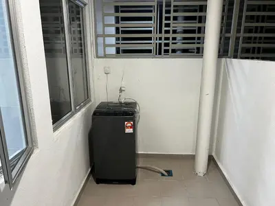 a heater in a room next to a window at Stay in Passionate in Sitiawan
