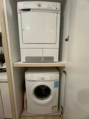 a washing machine with a computer on top of it at 2BR, 1 Car Park, 4Pax Seaview 118IslandPlaza in Tanjong Tokong