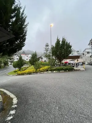 a street with a street light on the side of the road at Azzalea's Apartment Ground Floor Cameron Highlands in Tanah Rata