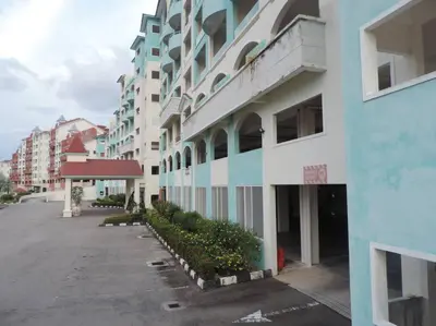 an empty parking lot in front of a building at Marina Island Seaview Homestay in Lumut