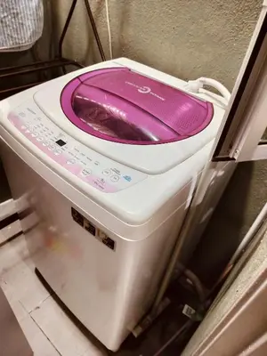 a purple and white toilet sitting in a kitchen at Idea Homestay 2 in Ipoh