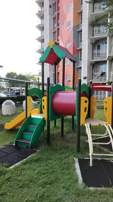 a playground with a slide in the grass at Idea Homestay 2 in Ipoh