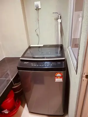 a small refrigerator with a water dispenser in a kitchen at Idea Homestay 3 in Chemor