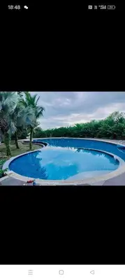 a picture of a large blue swimming pool at Idea Homestay 3 in Chemor