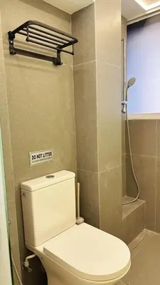 a bathroom with a white toilet and a shower at Noordin ClanJetties Komtar Heritage Studio - E in George Town