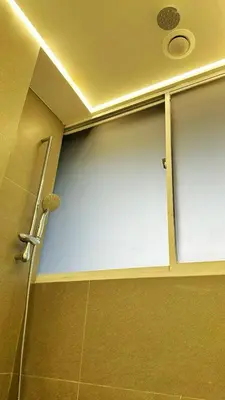 a shower stall with a sliding glass door in a bathroom at Noordin ClanJetties Komtar Heritage Studio - E in George Town