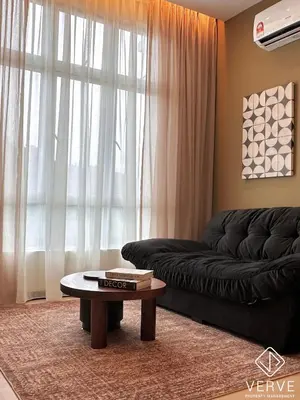 a living room with a couch and a coffee table at Ipoh Town Anderson Suites 4-6 pax by Verve in Ipoh