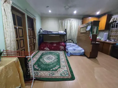 a room with bunk beds and a rug on the floor at Penang Green Homestay 1st Floor in Permatang Pauh