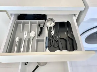 a drawer filled with utensils in a kitchen at Urban Suites #Creamy style #Infinity Pool #local neighbourhood #5pax #3BR 2bath #2Queen 1Single #Quality well maintained #Private host in Jelutong
