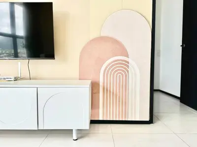 a room with a wall with a painting of a rainbow at Urban Suites #Creamy style #Infinity Pool #local neighbourhood #5pax #3BR 2bath #2Queen 1Single #Quality well maintained #Private host in Jelutong