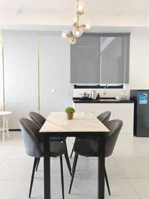 a dining table and chairs in a kitchen at Modern Elegance - Urban Suites by Ocean Luxe in Jelutong