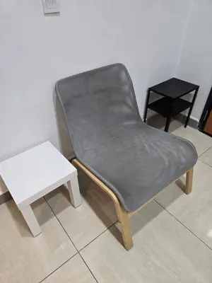 a leather chair and a table in a room at The Octagon Premium Suite - Ipoh in Ipoh