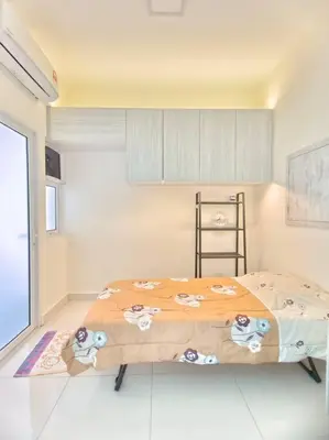 a bedroom with a bed in a room at Maritime Suite Penang - City & Sea view in George Town