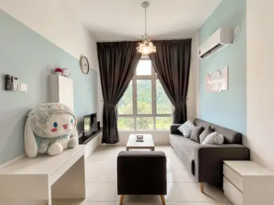 a living room with a couch and a large window at ANDERSON 2 Room Suite for 6-7 pax in Ipoh