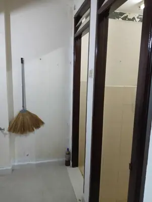 a broom hanging from a wall in a room at Yaakub homestay pangsapuri sutera jaya in Perai