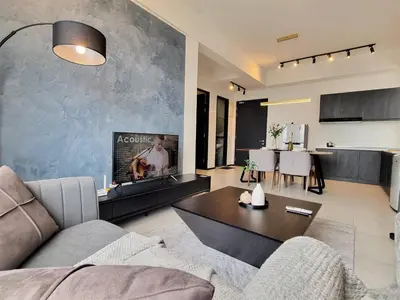 a living room with a couch and a table at Luxurious Modern Suite at Urban Suites Georgetown by SuperStay in Jelutong