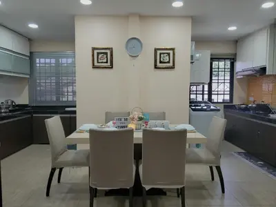 a kitchen with a table and chairs in a room at Cameron Brinchang 5 Min to Centrum 12pax Duplex Shophouse by City Home Empire in Brinchang