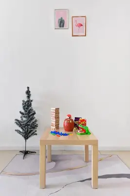 a wooden coffee table with a christmas tree on it at Crystal Creek 3BR Condo near Taiping Lake Garden & Zoo with WiFi Netflix in Taiping