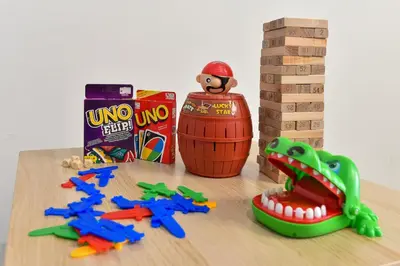 a wooden table with toys and a basketball and a snack at Crystal Creek 3BR Condo near Taiping Lake Garden & Zoo with WiFi Netflix in Taiping