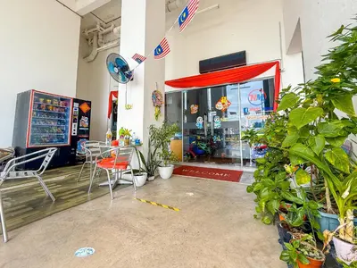 a store with tables and chairs in front of a store at Crystal Creek 3BR Condo near Taiping Lake Garden & Zoo with WiFi Netflix in Taiping