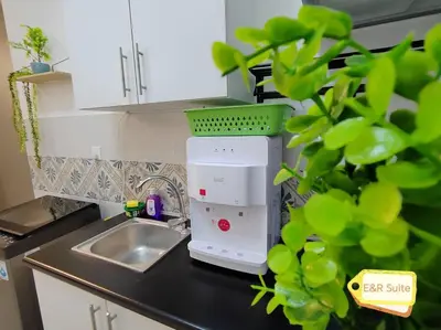 a kitchen counter with a mixer sitting next to a sink at Anderson, Ipoh at E&R Suite in Kampong Simee
