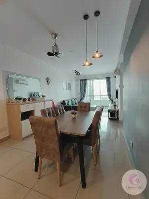 a dining room table and chairs in a living room at The Majestic Condo Ipoh Home Fairy 1 in Ipoh