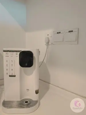 a microwave sitting on top of a white wall at The Majestic Condo Ipoh Home Fairy 1 in Ipoh