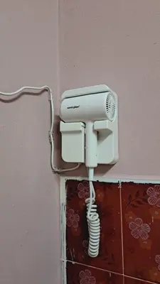 a security camera is attached to a wall at Faza Homestay Meru Ipoh in Ipoh