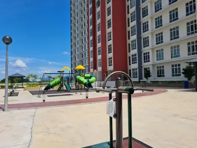 a playground in front of a large building at Premier Family Suite & City View Seven Houz Ipoh in Ipoh