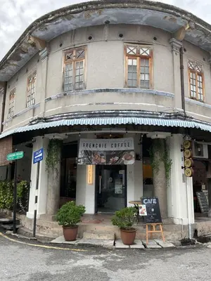 a building with a sign in front of it at Homs Female Hostel in George Town