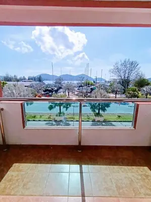 a large window with a view of the water at Marina HOMESTAY JETI LUMUT MANJUNG in Lumut