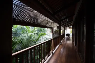 an empty balcony with a view of a garden at Muntri Grove in George Town