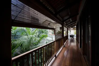 a hallway of a house with a balcony with plants at Muntri Grove in George Town